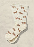 White socks with brown horse pattern on a beige background