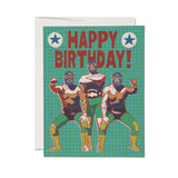Luchador birthday card featuring three masked wrestlers by a Happy Birthday! sign, printed on paper in vibrant colors.