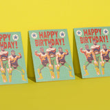Set of Luchador birthday cards featuring wrestlers on a green grid, printed in USA, shown on a yellow background.