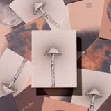Greeting card with red mushroom design, celestial accents, and abstract details on recycled paper. Suitable for everyday use.