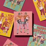 Greeting card with masked wrestlers on the cover, blank recycled paper interior, ideal for congratulations.
