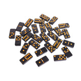 Set of black dominoes with orange dots on a white background