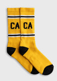 Yellow socks with black heels, striped cuffs, and CA lettering; suitable for everyday wear.