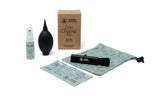 Rocs lens cleaning kit with spray bottle, brush, and cloth on a white background