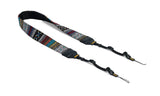 Multicolored camera strap with metal clasp on a white background