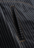 Pinstriped black dark wash shirt pocket with brown stitching, made of sturdy cotton, suitable for casual wear.