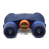 Waterproof binoculars in blue and black with textured grip, orange center knob; suitable for travel use.