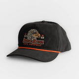 Black cotton hat with embroidered eagle and stars, orange trim detail, and adjustable strap for comfort.