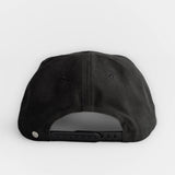 Black cotton twill cap with adjustable strap and two back ventilation holes, designed for everyday wear.