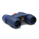 Waterproof binoculars featuring blue eyepieces, orange focus knob, and textured grip; compact design suited for travel.