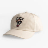 Beige cotton hat with adjustable strap and embroidered cartoon cowboy skull on the front, ideal for casual western wear.
