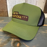 Evergreen vintage trucker hat with embroidered front and moisture-wicking sweatband for comfort.