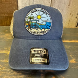 Blue mesh trucker hat with Hermosa Beach California lifeguard patch and comfy fit label