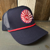 Navy 5-panel trucker hat with red braid and patriotic patch, ideal for outdoor summer wear.