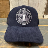 Navy corduroy 6-panel trucker hat with California patch and wave graphic, designed for casual wear.