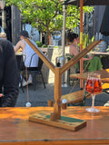 Acacia wood tabletop ring toss game in natural brown, designed for group outdoor play.