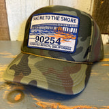 Camo foam cap with front pier graphic and TAKE ME TO THE SHORE 90254 patch, suitable for casual outdoor use.