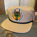 Khaki cotton hat with a cactus patch, orange sun detail, and embroidered text; ideal for casual outdoor wear.