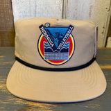 Khaki cotton volleyball hat displayed on a wooden surface.