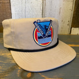 Khaki nylon/cotton hat with a patch featuring a net, ball, and vibrant background; ideal for sports and casual wear.
