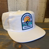 White nylon/cotton blend hat with 1 to 3 FEET HIGH & RISING patch, designed for everyday casual wear.