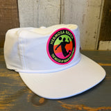 White nylon/cotton blend hat with a rectangular patch that reads “The Mecca of Beach Volleyball.”.