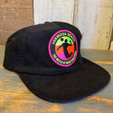 Black 6-panel micro cord hat with volleyball player silhouette and patch reading THE MECCA OF BEACH VOLLEYBALL.