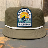 Army green surf rope cap with front patch and white rope detailing; suitable for casual outdoor use.