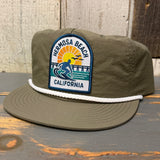 Army green and white surf rope cap with embroidered 1 to 3 FEET HIGH & RISING patch and Hermosa Beach motif.