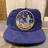 Navy corduroy field trip hat with a desert night-themed patch, suitable for outdoor or casual use.