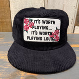 Black corduroy hat with a patch displaying text and red rose graphics. Suitable for casual wear.