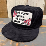 Black corduroy hat with red rose patch and adjustable strap for fit.
