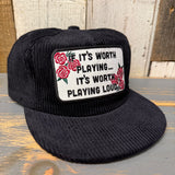 Black corduroy hat featuring a slogan patch and red rose design, suitable for casual wear.