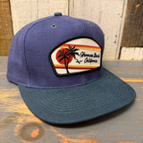Navy and dark green 6-panel low profile cap with California patch and palm tree design, suitable for casual wear.