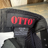 Closeup of OTTO black adjustable perforated cap label showing sizing and origin.