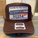 Brown high crown trucker hat with mesh back, fabric front panel, and embroidered patch featuring pier graphic and 90254.
