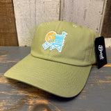 Desert green cotton dad hat with lifeguard tower design, displayed on a rustic wooden surface. Suitable for casual wear.