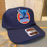 Navy blue cap with a colorful Volleyball patch and 'OTTO' label on a wooden surface