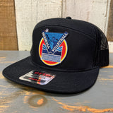 Black cap with a colorful logo on a wooden surface