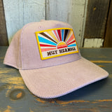 Dusty rose five-panel corduroy cap with sunrise patch; suitable for casual wear.