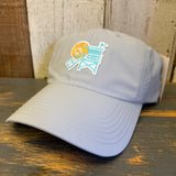 light grey cap with a beach chair and sun design on a wooden surface