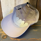 Beige cap on a wooden surface