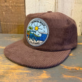Java brown corduroy field trip hat with a patch featuring sun, waves, tower, and palm tree.