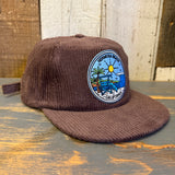 Java brown corduroy field trip hat with a sunny beach patch, ideal for outdoor or casual wear.