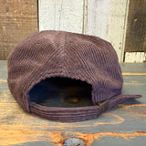 Java brown corduroy field trip hat, back view, displayed on a wooden surface.