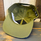Camo 6-panel hat with visible inside stitching and cotton tags, designed for casual wear.