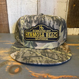 Camo 5-panel snapback hat in green, made from durable fabric, suitable for casual wear or outdoor activities.