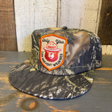 5-panel surf camo hat with a Smokey Bear patch, made of fabric, ideal for outdoor casual wear.