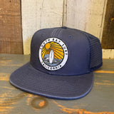 Midnight navy trucker hat with multiple patches, mesh back, and structured front panels for casual wear.