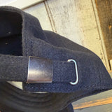Tan 6-panel strapback hat with adjustable fabric strap and silver metal buckle, suitable for everyday wear.